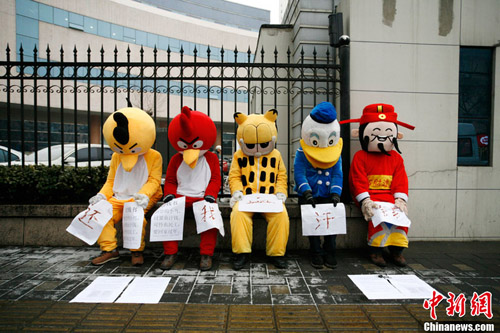 Migrant workers in Beijing dressed in cartoon costumes to protest unpaid wages