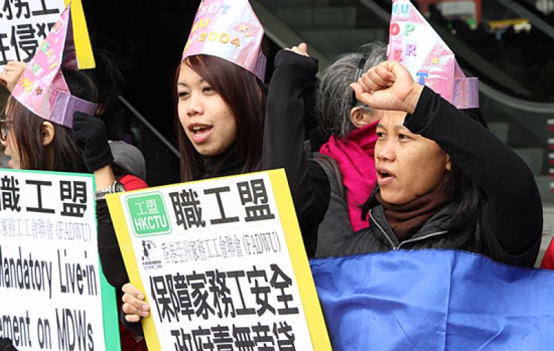 Foreign domestic workers in Hong Kong hold a rally on Sunday, March 3, calling for abolishment of the rule requiring them to live with their employers.